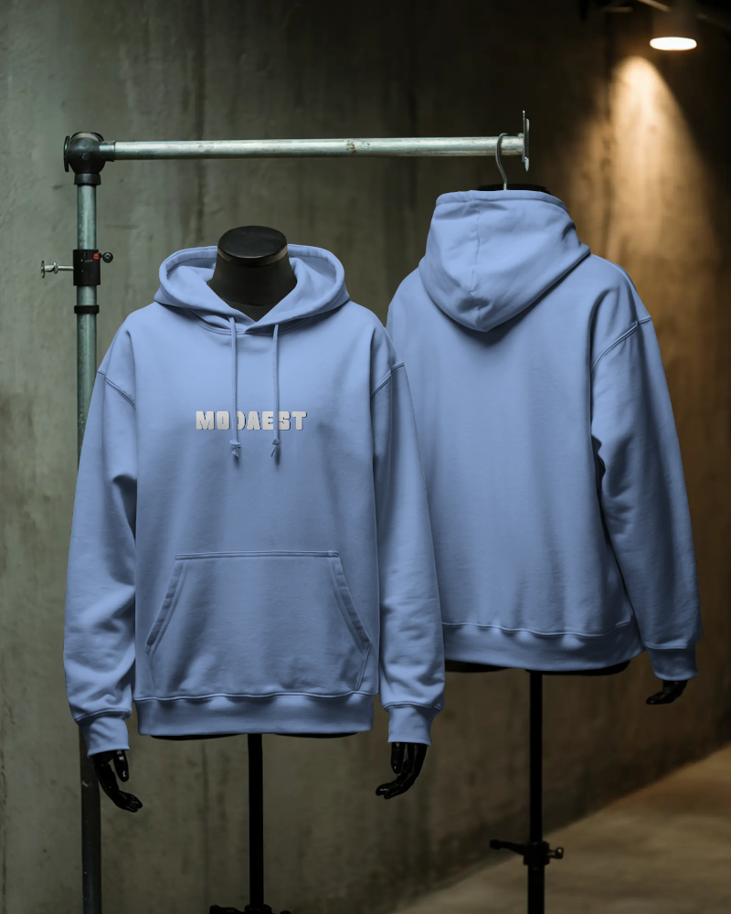Light blue hoodie displayed on mannequins with 'MOJAEST' branding.