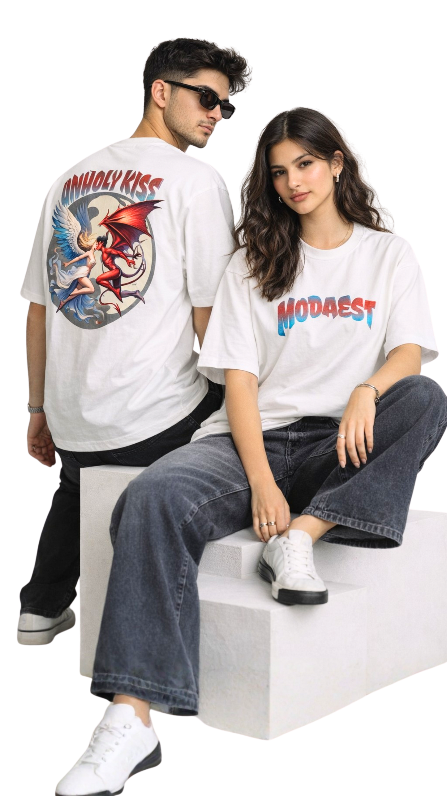 White oversized t-shirt featuring "Unholy Kiss" graphic design by Modaest, displayed against a neutral background.