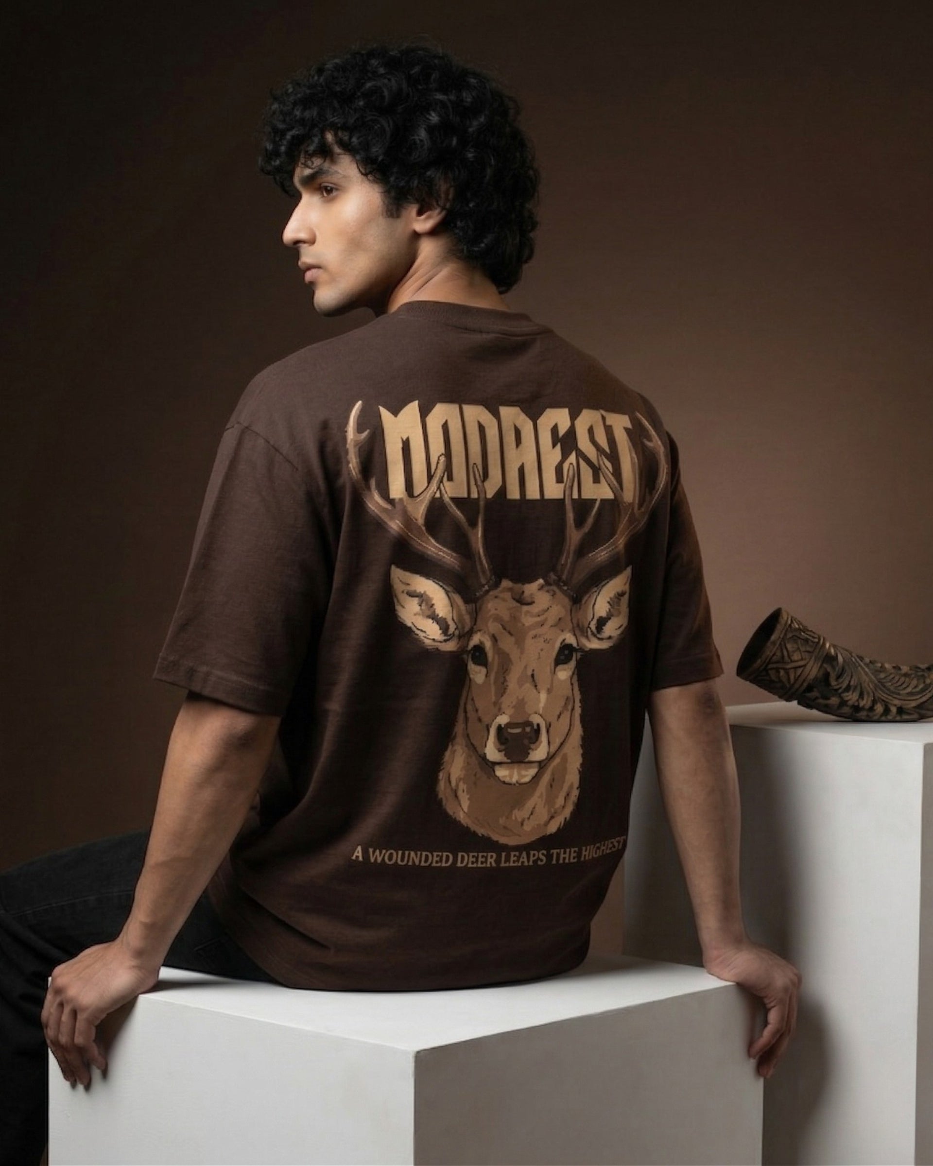 Modaest Apex Stag oversized T-shirt featuring a bold stag graphic on soft, comfortable fabric for a casual streetwear look.