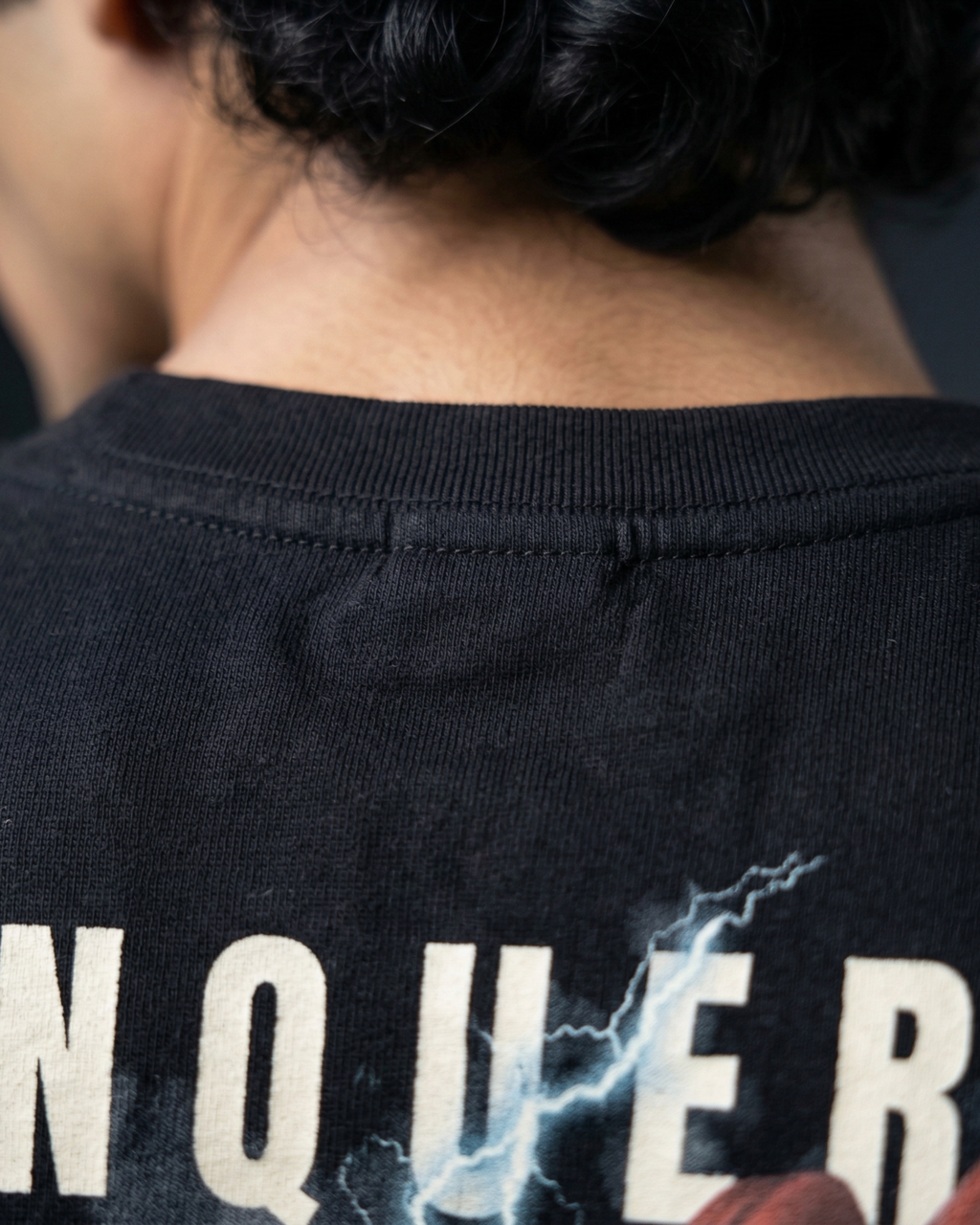 Oversized Modaest Conqueror T-shirt with bold graphic design, soft fabric, and relaxed fit, perfect for casual streetwear style.