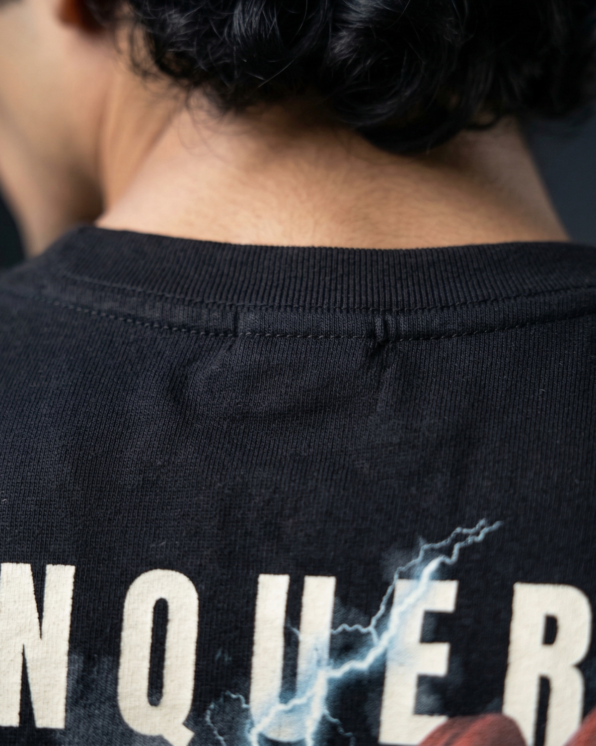 Oversized Modaest Conqueror T-shirt with bold graphic design, soft fabric, and relaxed fit, perfect for casual streetwear style.